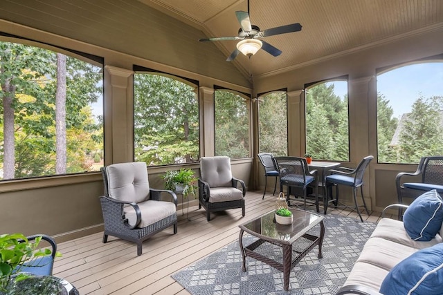 sunroom with ceiling fan, lofted ceiling, and plenty of natural light