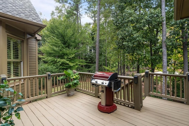 wooden deck featuring area for grilling