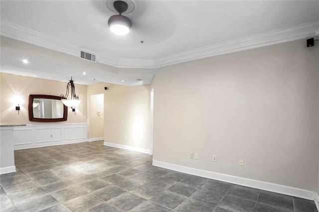 unfurnished living room with visible vents, baseboards, a ceiling fan, and crown molding