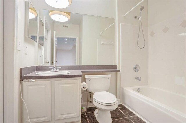 full bathroom with tile patterned floors, visible vents, toilet, shower / bath combination, and vanity