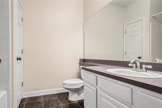 bathroom featuring tile patterned floors, baseboards, toilet, and vanity