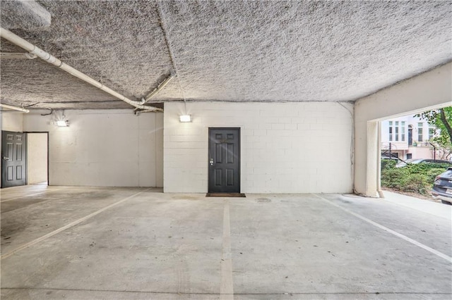 garage featuring concrete block wall