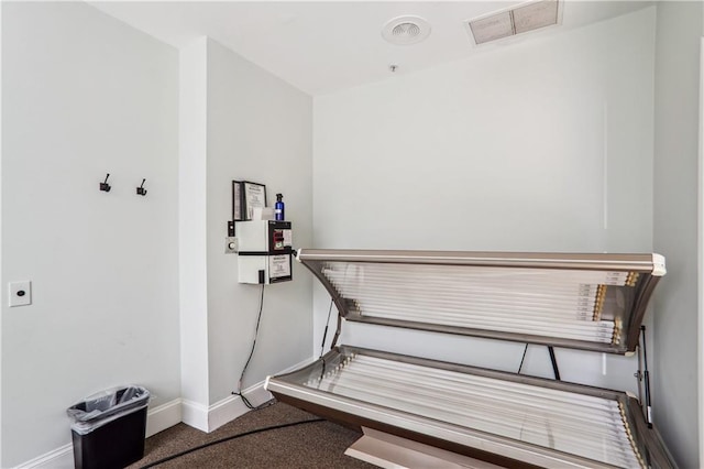 miscellaneous room featuring visible vents and baseboards