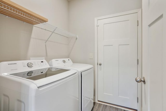 1360 Sugar Glen Ct, Lawrenceville, GA 30044 - laundry room featuring independent washer and dryer and wood finished floors