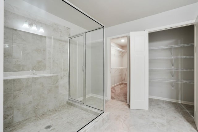 1360 Sugar Glen Ct, Lawrenceville, GA 30044 - bathroom featuring a shower stall, a walk in closet, a garden tub, and marble finish flooring