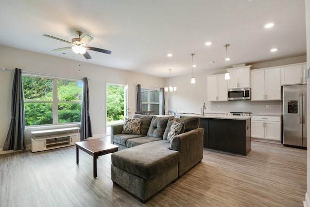 1360 Sugar Glen Ct, Lawrenceville, GA 30044 - living area with light wood-type flooring, ceiling fan, and recessed lighting