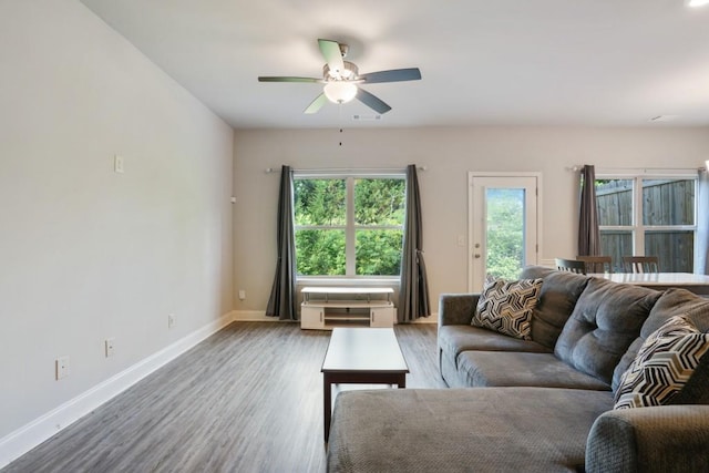 1360 Sugar Glen Ct, Lawrenceville, GA 30044 - living room featuring wood finished floors, ceiling fan, and baseboards