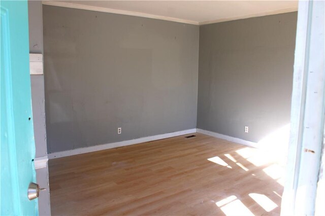 1189 Hartley St, Macon, GA 31206 - unfurnished room featuring crown molding, wood finished floors, and baseboards