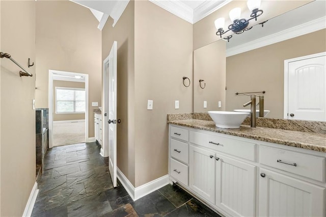 bathroom with ornamental molding and vanity