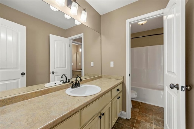 full bathroom featuring bathing tub / shower combination, vanity, and toilet