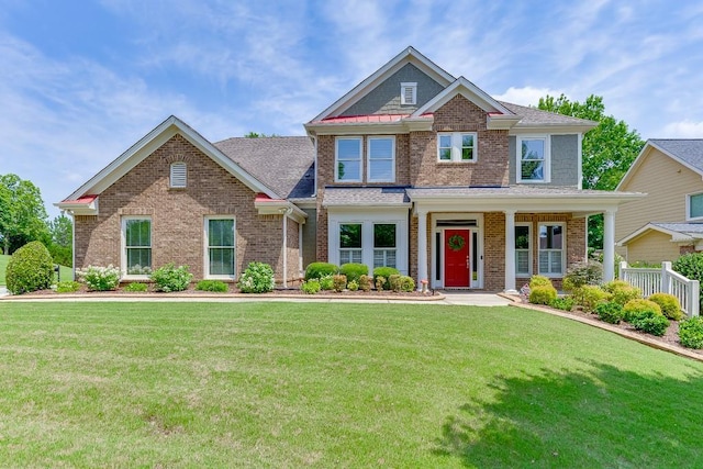 7405 Brookstone Way, Flowery Branch, GA 30542 - craftsman-style home featuring a front lawn, brick siding, and covered porch