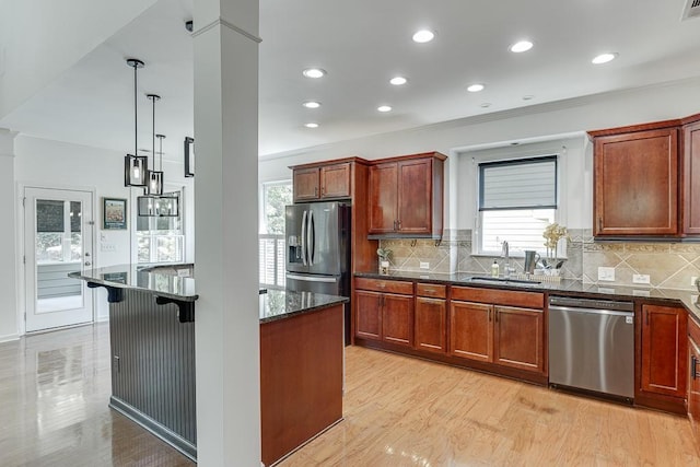 7405 Brookstone Way, Flowery Branch, GA 30542 - kitchen featuring stainless steel appliances, light wood-style floors, plenty of natural light, recessed lighting, and crown molding