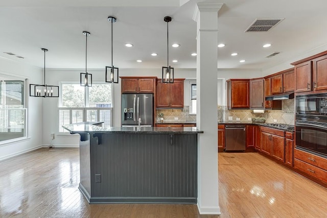 7405 Brookstone Way, Flowery Branch, GA 30542 - kitchen with black appliances, under cabinet range hood, light wood-style flooring, a breakfast bar area, and dark stone counters