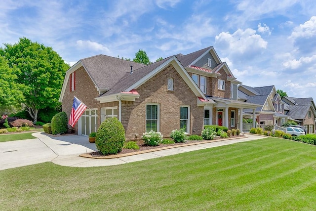 7405 Brookstone Way, Flowery Branch, GA 30542 - view of front of home with brick siding, driveway, a front lawn, and roof with shingles