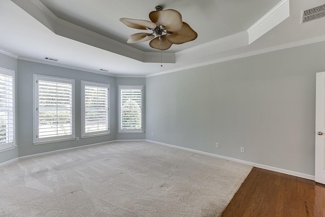 7405 Brookstone Way, Flowery Branch, GA 30542 - spare room with a raised ceiling, ceiling fan, crown molding, and wood finished floors