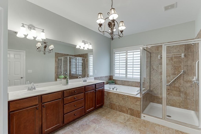 7405 Brookstone Way, Flowery Branch, GA 30542 - bathroom featuring a chandelier, a garden tub, a stall shower, and double vanity