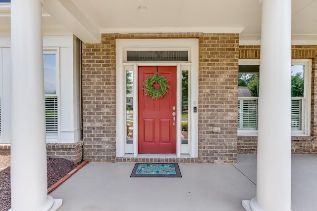 7405 Brookstone Way, Flowery Branch, GA 30542 - entrance to property featuring brick siding and covered porch
