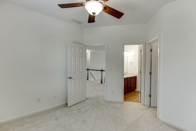 7405 Brookstone Way, Flowery Branch, GA 30542 - unfurnished bedroom featuring light carpet, ensuite bath, and a ceiling fan