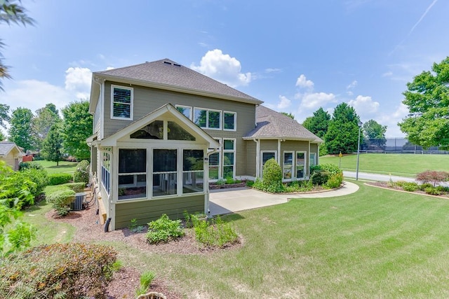 7405 Brookstone Way, Flowery Branch, GA 30542 - back of house featuring a sunroom and a yard
