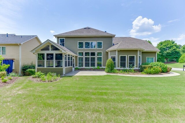 7405 Brookstone Way, Flowery Branch, GA 30542 - rear view of house with a patio, a yard, and a sunroom