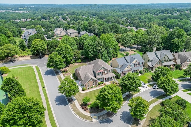 7405 Brookstone Way, Flowery Branch, GA 30542 - aerial perspective of suburban area with a heavily wooded area
