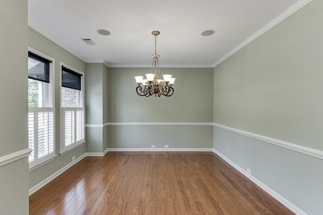 7405 Brookstone Way, Flowery Branch, GA 30542 - empty room featuring wood finished floors, a chandelier, and ornamental molding