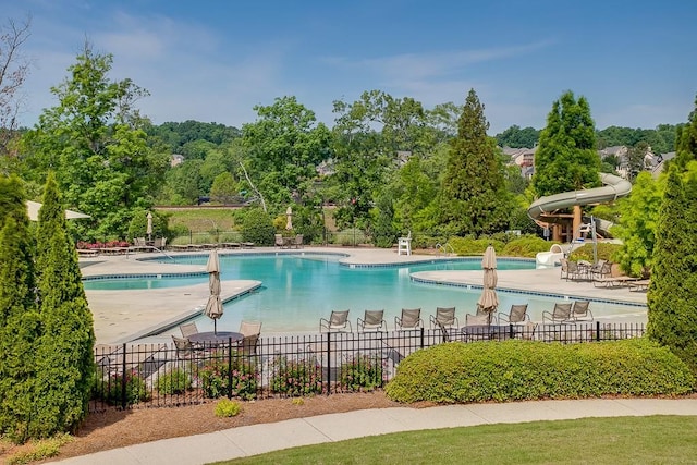7405 Brookstone Way, Flowery Branch, GA 30542 - community pool with a water slide and a patio area