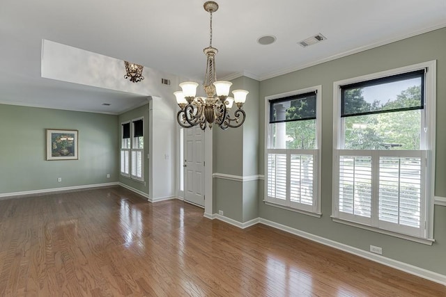 7405 Brookstone Way, Flowery Branch, GA 30542 - spare room featuring a chandelier, crown molding, and wood finished floors
