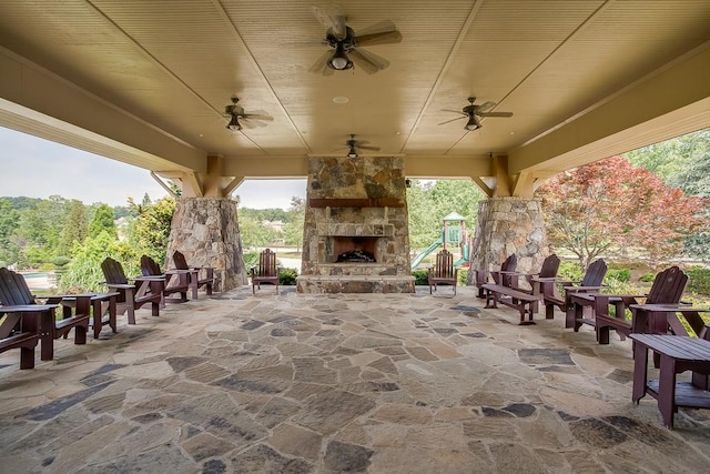 7405 Brookstone Way, Flowery Branch, GA 30542 - view of patio featuring an outdoor stone fireplace