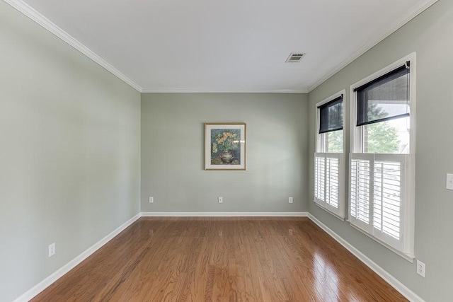 7405 Brookstone Way, Flowery Branch, GA 30542 - unfurnished room with crown molding and dark wood-type flooring