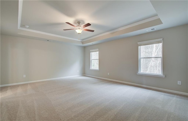 251 Arnewood Cir, Mcdonough, GA 30253 - carpeted empty room with a raised ceiling, a ceiling fan, and crown molding