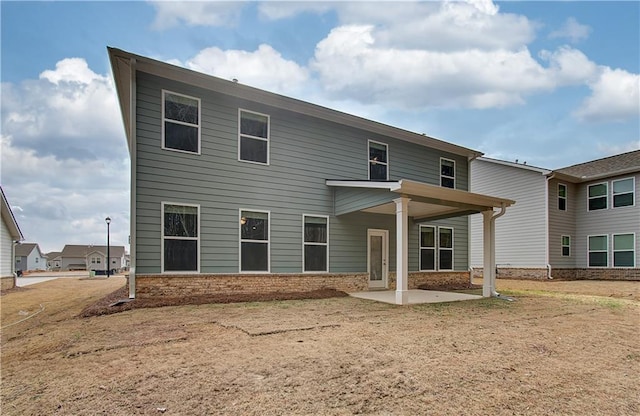 251 Arnewood Cir, Mcdonough, GA 30253 - rear view of house featuring a patio area