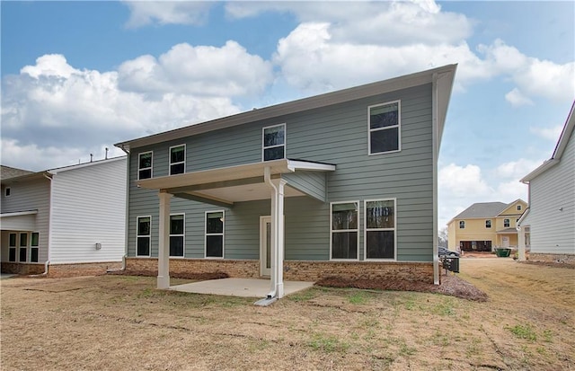 251 Arnewood Cir, Mcdonough, GA 30253 - back of house with a patio and brick siding