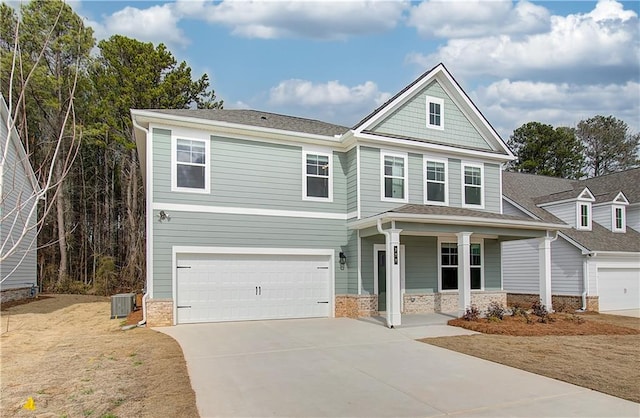 251 Arnewood Cir, Mcdonough, GA 30253 - view of front of house featuring a porch, an attached garage, concrete driveway, and stone siding
