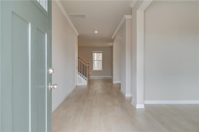 251 Arnewood Cir, Mcdonough, GA 30253 - entrance foyer featuring light wood-type flooring, stairs, and ornamental molding