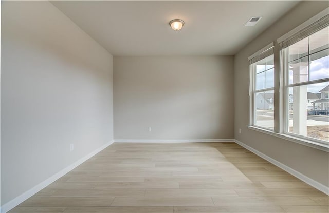 251 Arnewood Cir, Mcdonough, GA 30253 - spare room featuring light wood-style flooring and baseboards