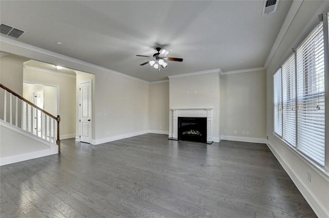 unfurnished living room with ornamental molding, dark wood-type flooring, and ceiling fan