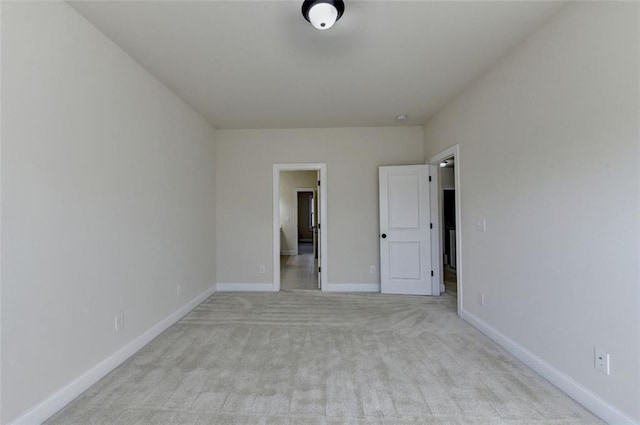 unfurnished bedroom with light colored carpet