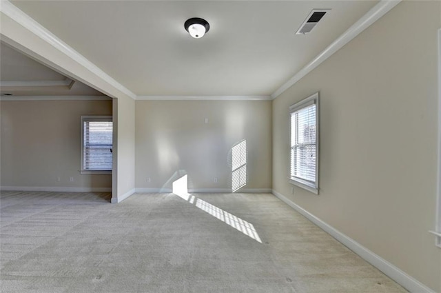 unfurnished room featuring light colored carpet and ornamental molding