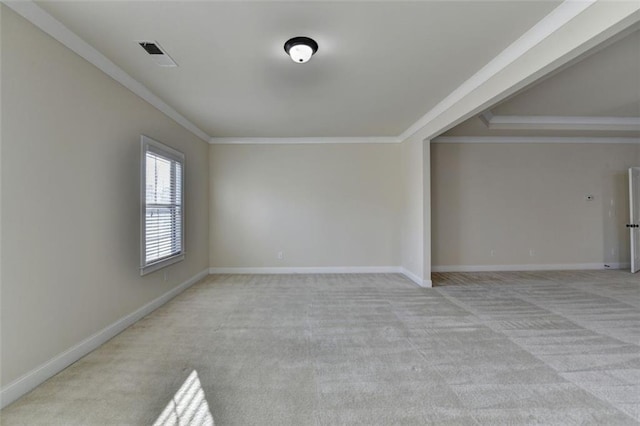 carpeted spare room with crown molding