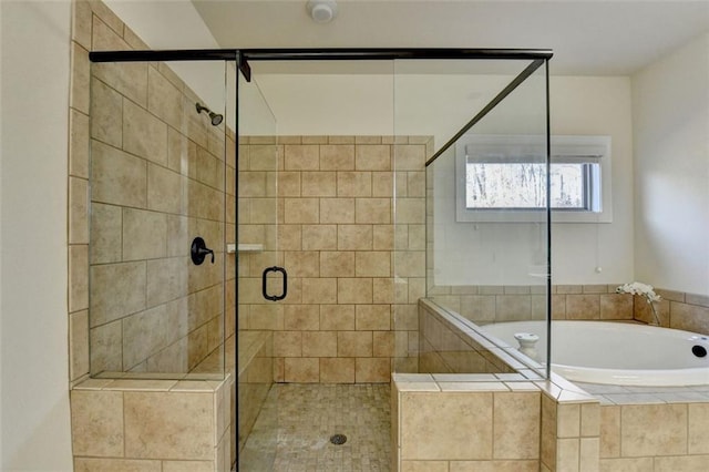 bathroom featuring separate shower and tub