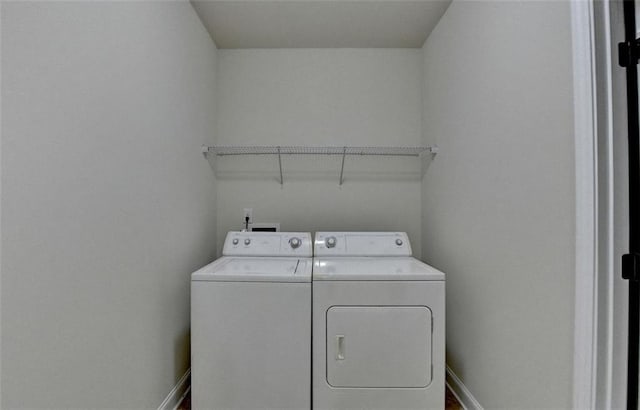 washroom with independent washer and dryer