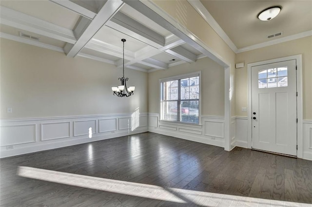 entrance foyer featuring coffered ceiling, crown molding, a chandelier, dark hardwood / wood-style flooring, and beam ceiling