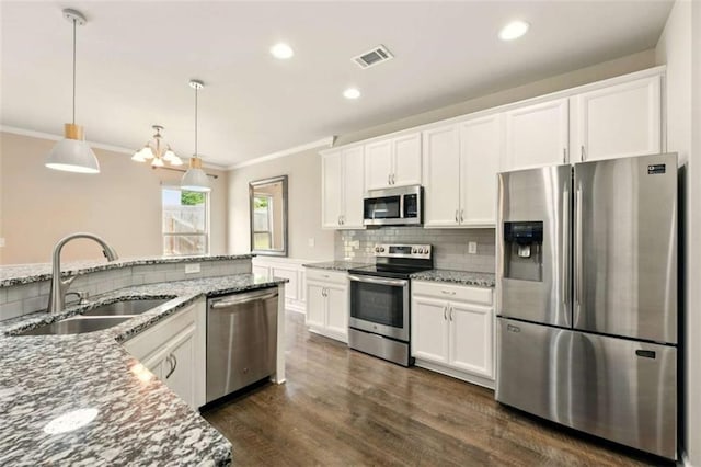 119 Hardy Water Dr, Lawrenceville, GA 30045 - kitchen featuring stainless steel appliances, a sink, ornamental molding, backsplash, and light stone counters
