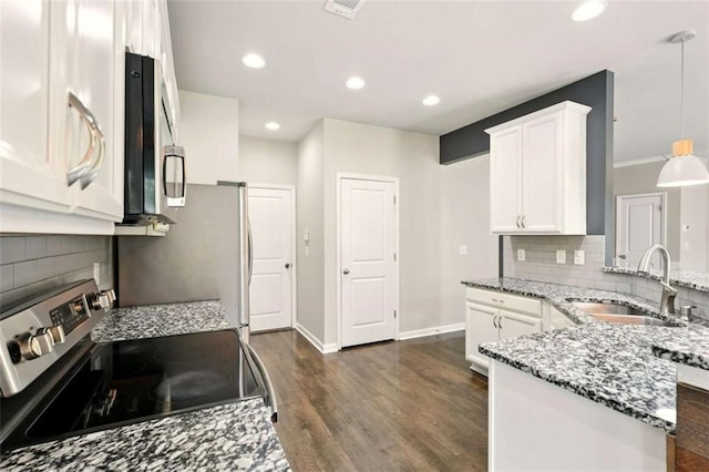 119 Hardy Water Dr, Lawrenceville, GA 30045 - kitchen featuring stainless steel appliances, a sink, white cabinets, light stone countertops, and dark wood-style flooring