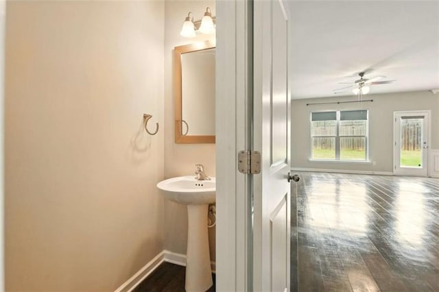 119 Hardy Water Dr, Lawrenceville, GA 30045 - bathroom featuring baseboards, wood finished floors, ceiling fan, and a sink