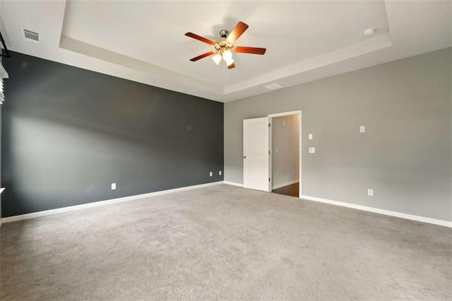 119 Hardy Water Dr, Lawrenceville, GA 30045 - carpeted spare room with a raised ceiling, ceiling fan, and baseboards