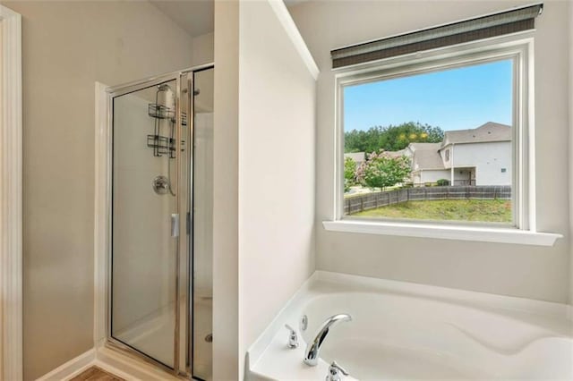 119 Hardy Water Dr, Lawrenceville, GA 30045 - full bath featuring a stall shower, plenty of natural light, and a bath