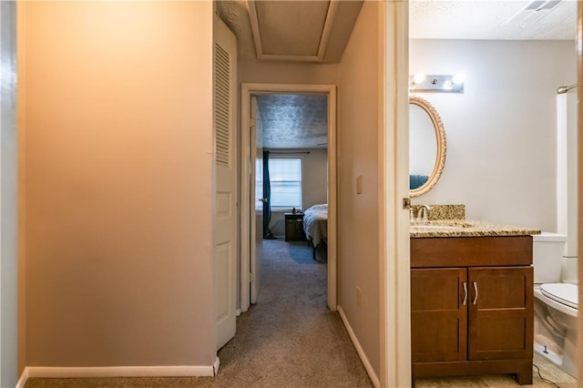 1406 Springleaf Cir SE, Smyrna, GA 30080 - hall featuring a sink, light colored carpet, and baseboards