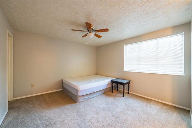 1406 Springleaf Cir SE, Smyrna, GA 30080 - unfurnished bedroom featuring carpet, baseboards, ceiling fan, and a textured ceiling